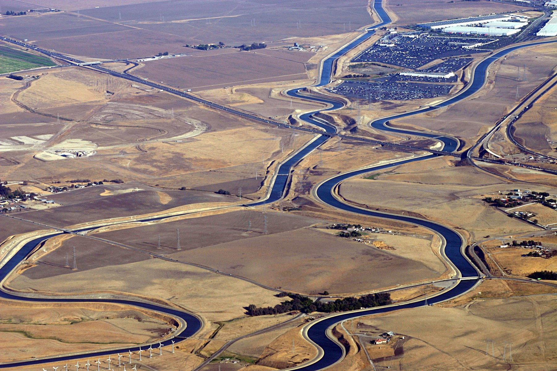Aerial view of a large aqueduct carrying water across the landscape