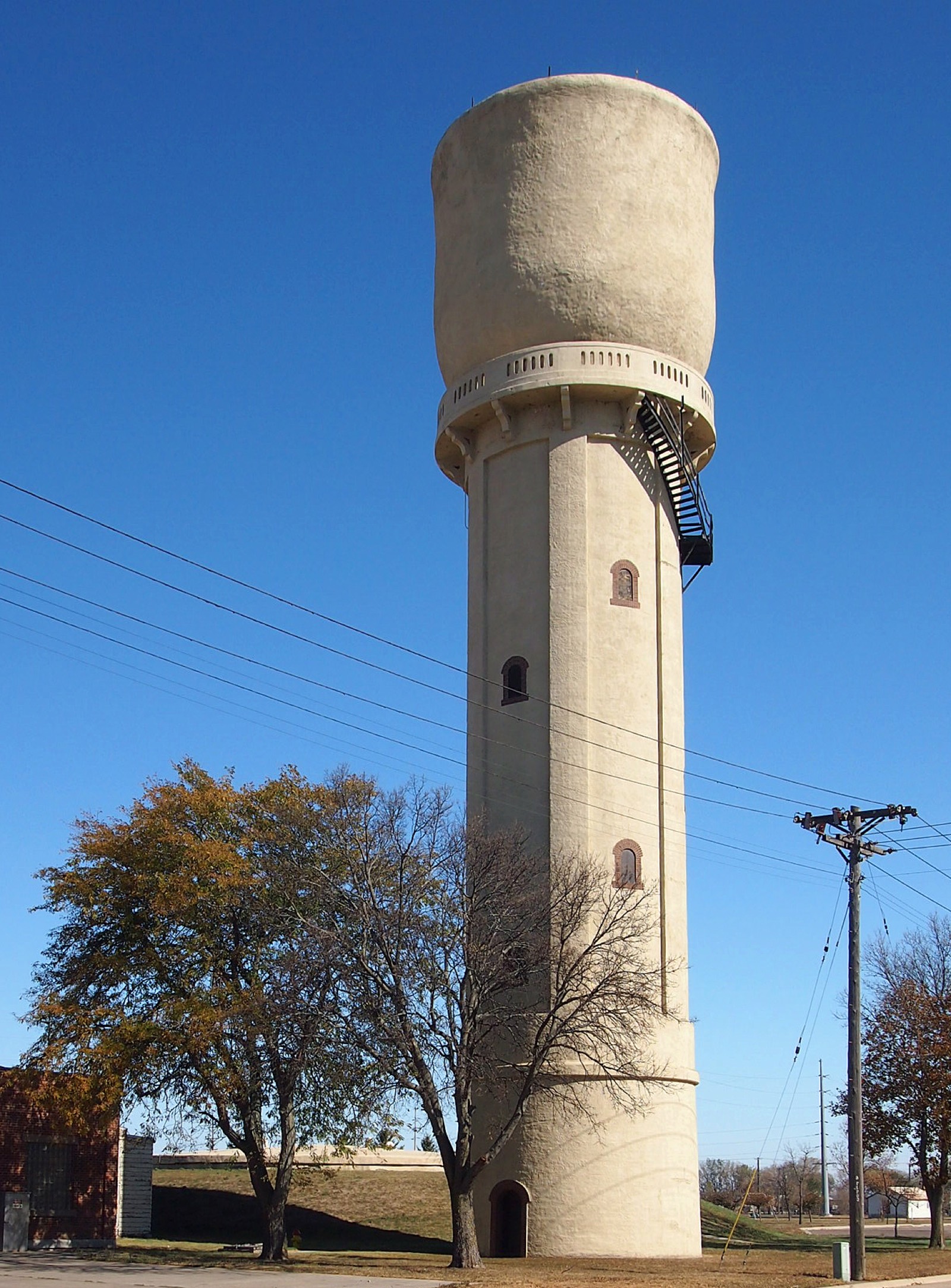 Concrete municipal water tower against the sky